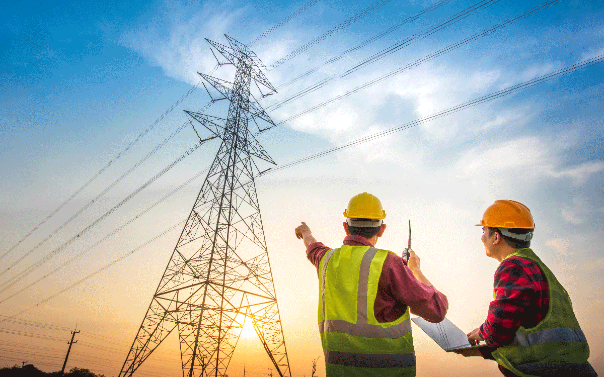 power workers standing by power lines